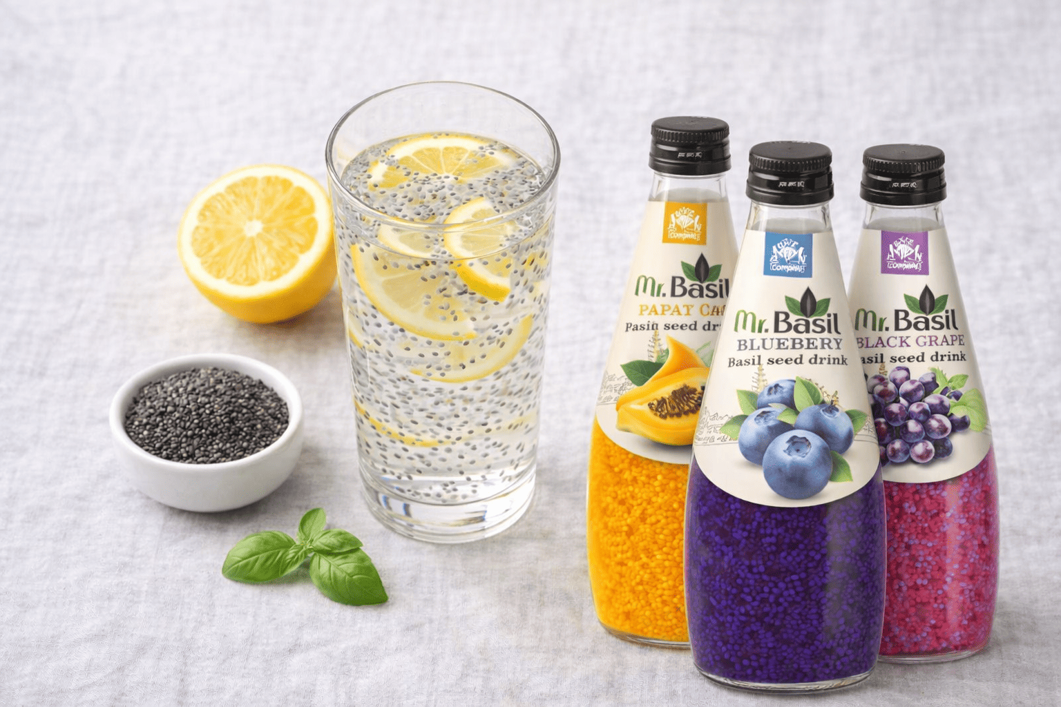 Soaked basil seeds in a glass of water showing the clear gel coating around each seed